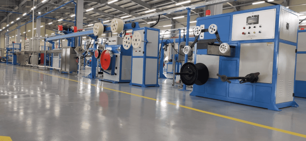 Fiber optic cable manufacturing equipment in a factory