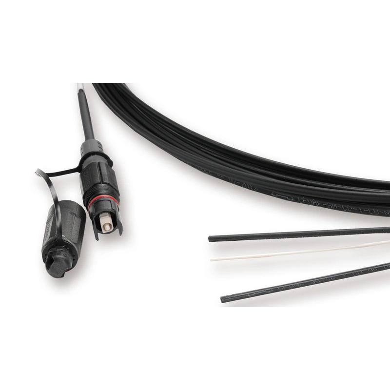 Close-up of OptiTap-style hardened SC/APC connector attached to flat FTTH drop cable