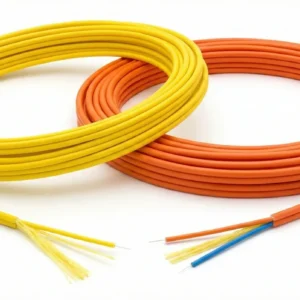 Coils of yellow (simplex) and orange (duplex) GJFJV indoor fiber showing 900 µm tight buffer cores and aramid yarn strength members at the cable ends.