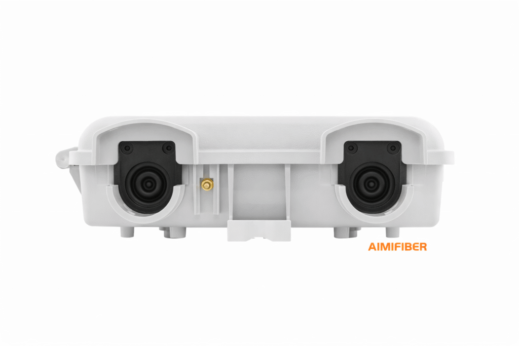 FTTH NID enclosure bottom view with dual cable entry ports and sealing grommets