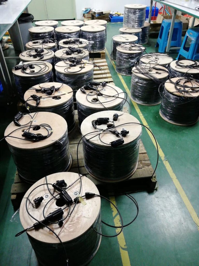 Tactical field fiber optic cable bulk production on reels with rugged TPU jacket