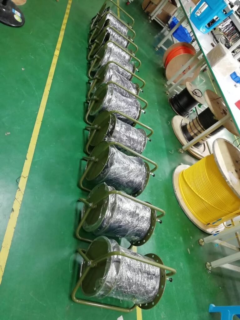 Deployable tactical fiber optic cable reel with TPU jacket for field and military use