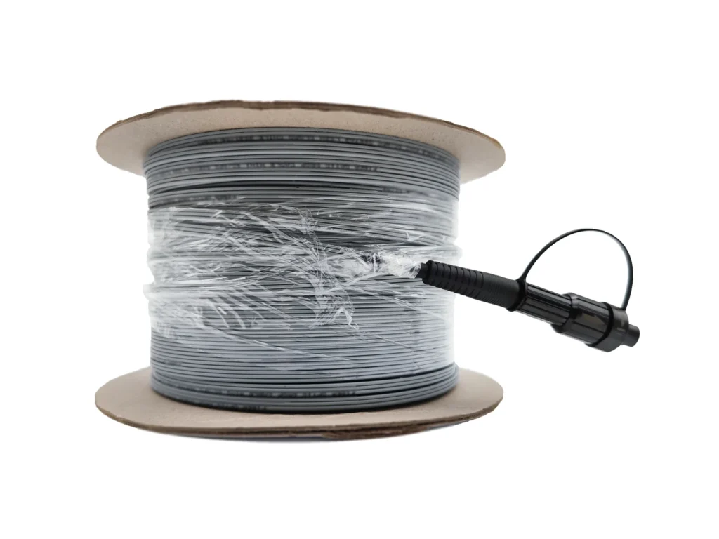 Pre-connectorized Figure-8 FTTH drop cable on reel with shrink wrap and SC/APC bullet connector