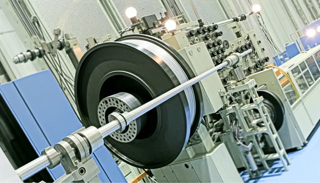 A comprehensive view of an FTTH drop cable extrusion line in operation.